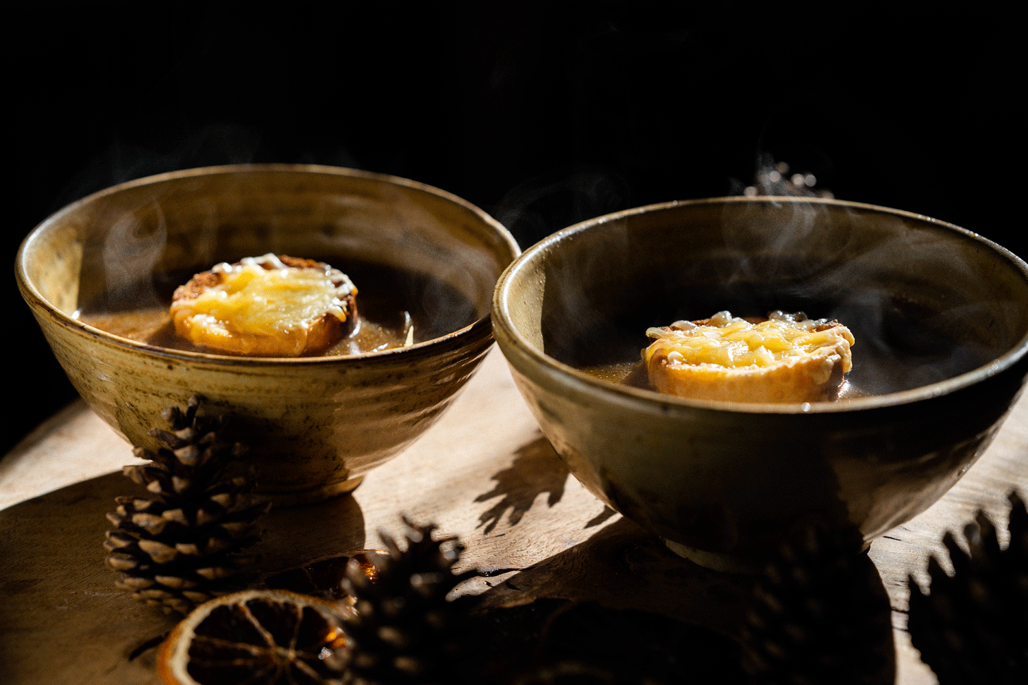 The French Onion Soup piping hot and ready to eat from the bowls.