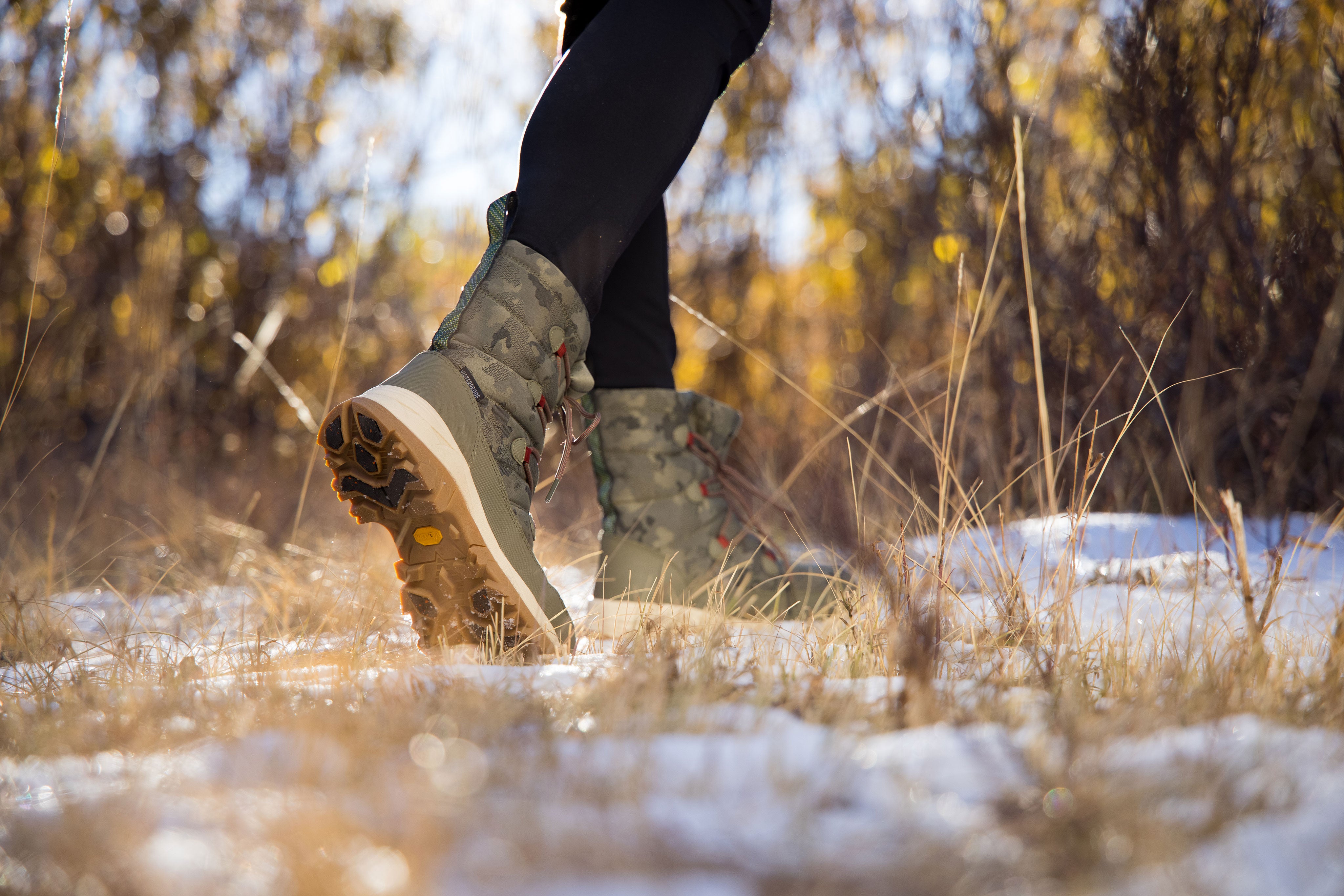 woman walking through icy fields 