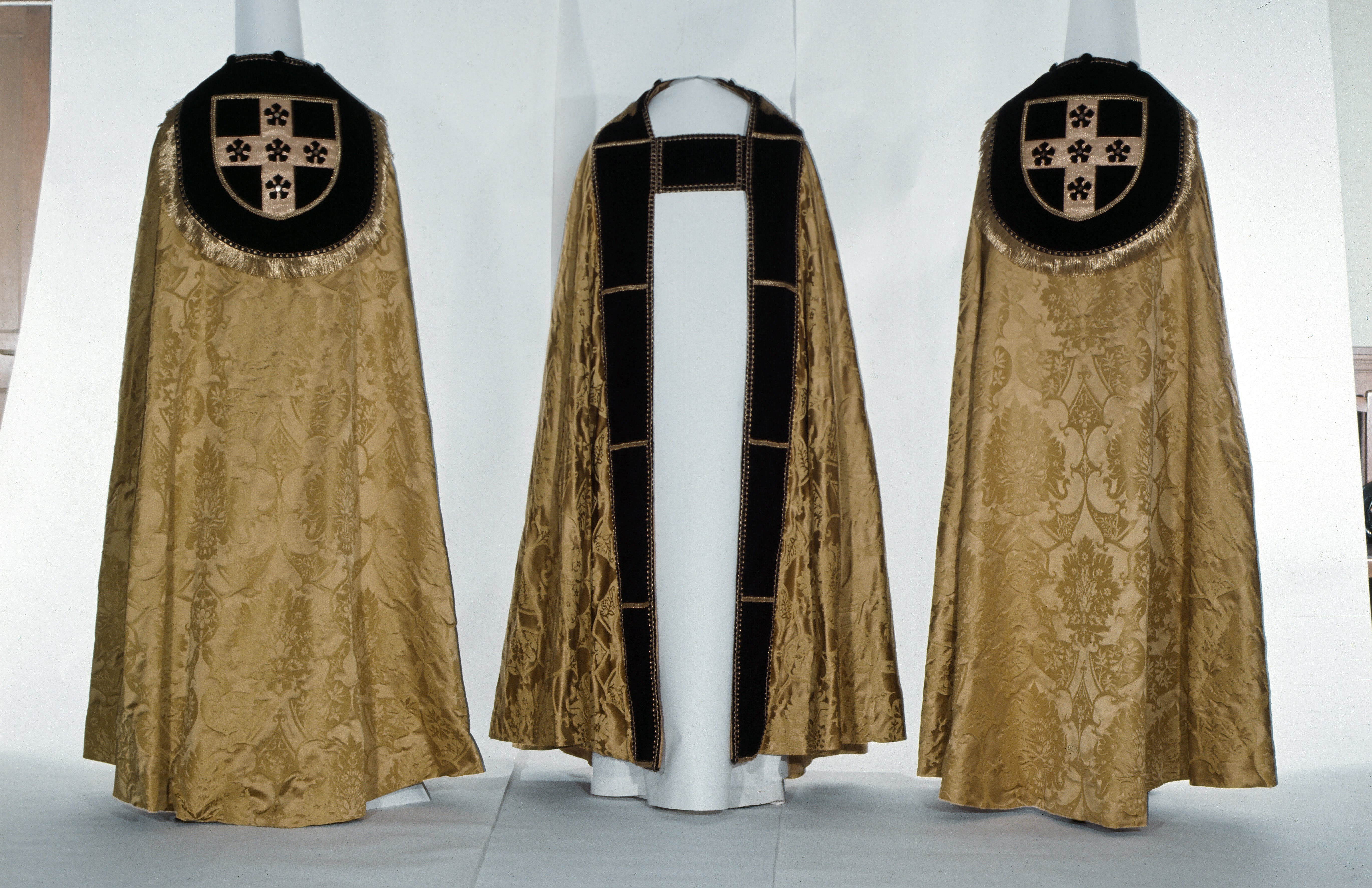 Three copes made with 'Gothic' silk damask, from our archive.