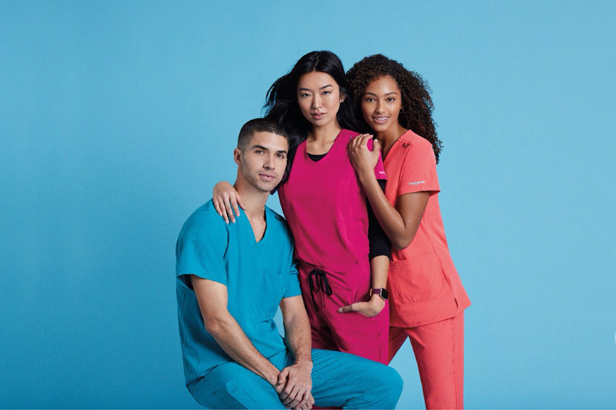 Three nurses wearing Skechers by Barco Scrubs