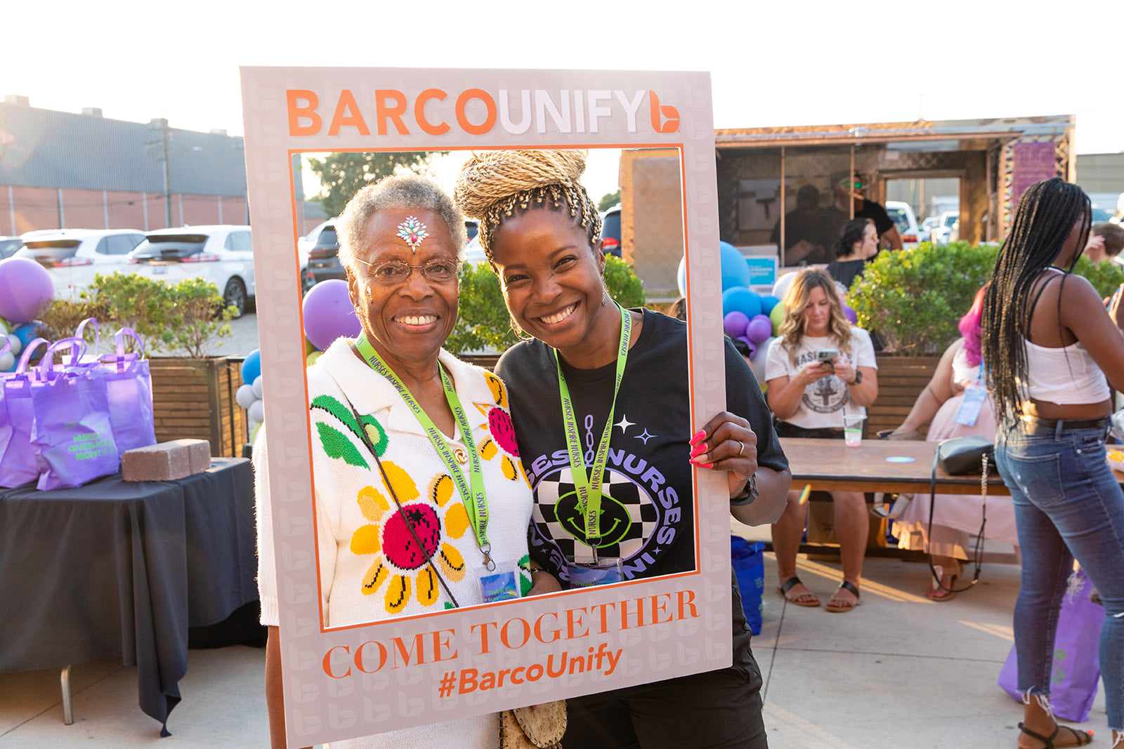 Barco Uniforms designer Chivon Parks with a local nurse at the Nurses Inspiring Nurses giveback event