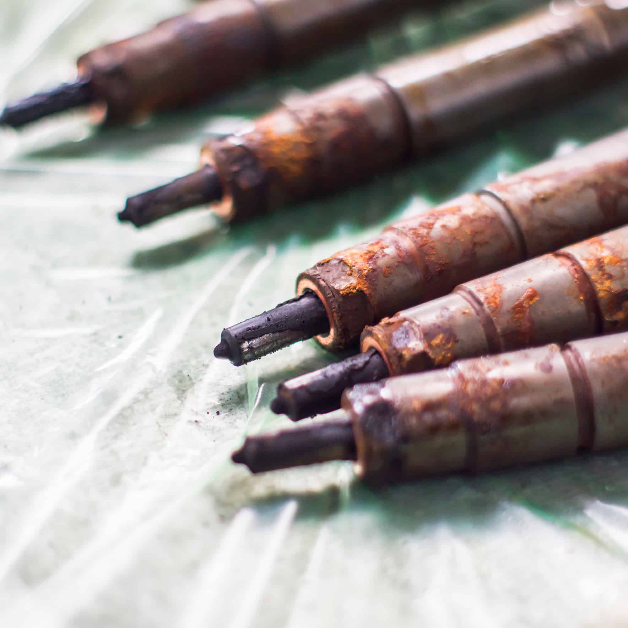 A close up of rusty fuel injectors