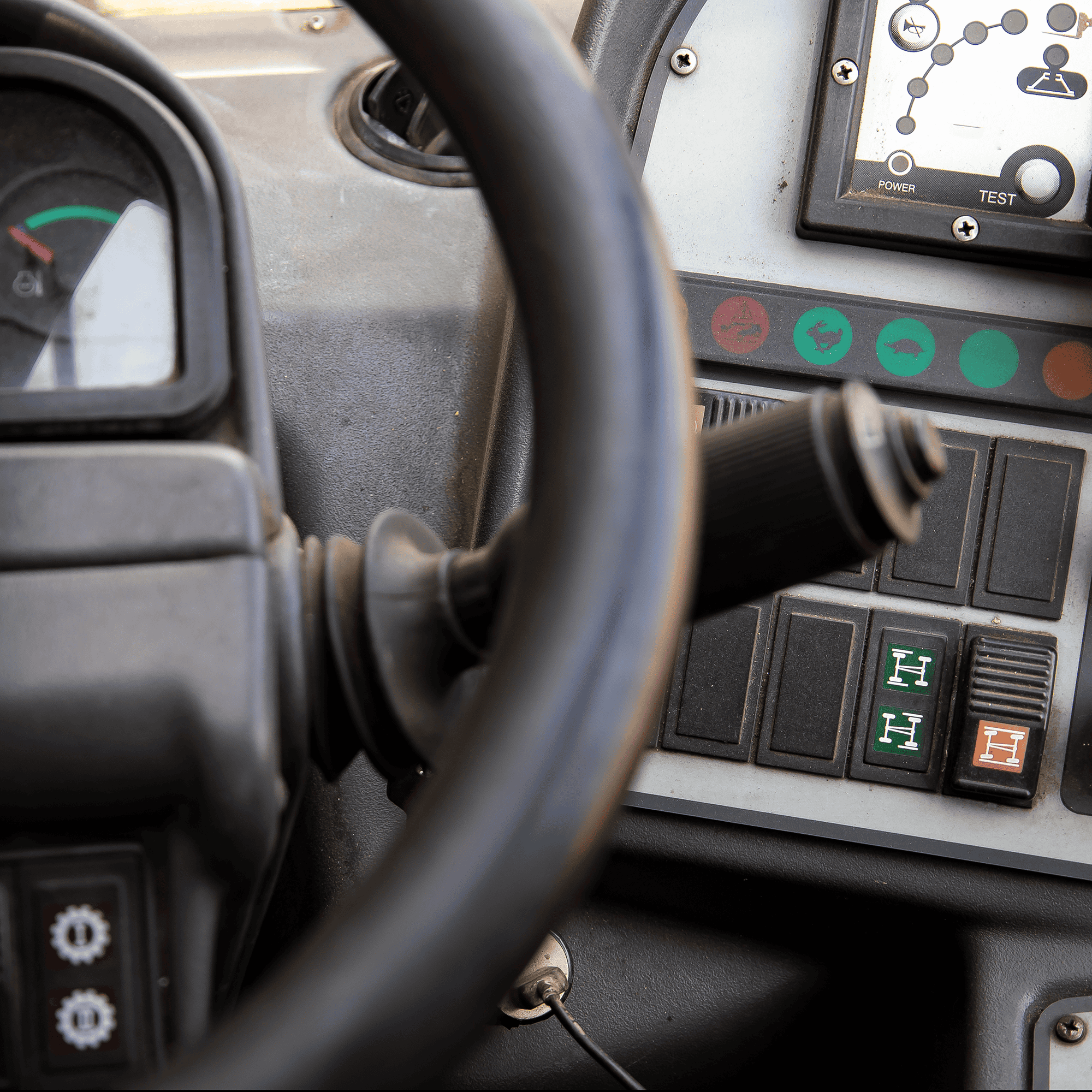The inside dash in the cab of a heavy equipment machine
