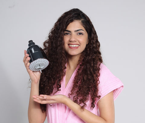 girl holding shower filter