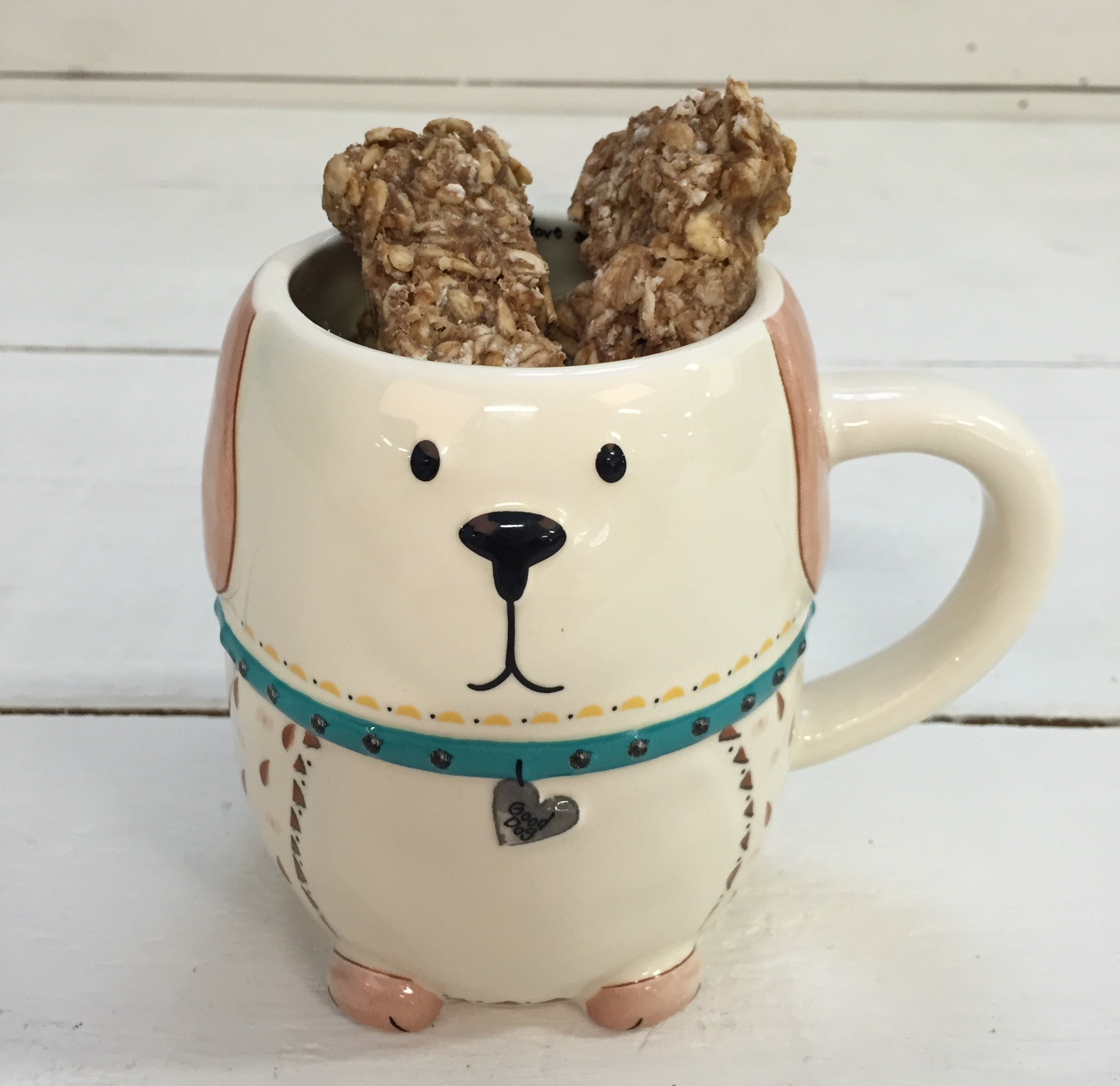 Homemade dog treats in a Natural Life mug