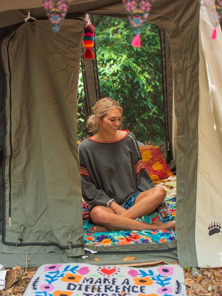 girl hanging out in tent