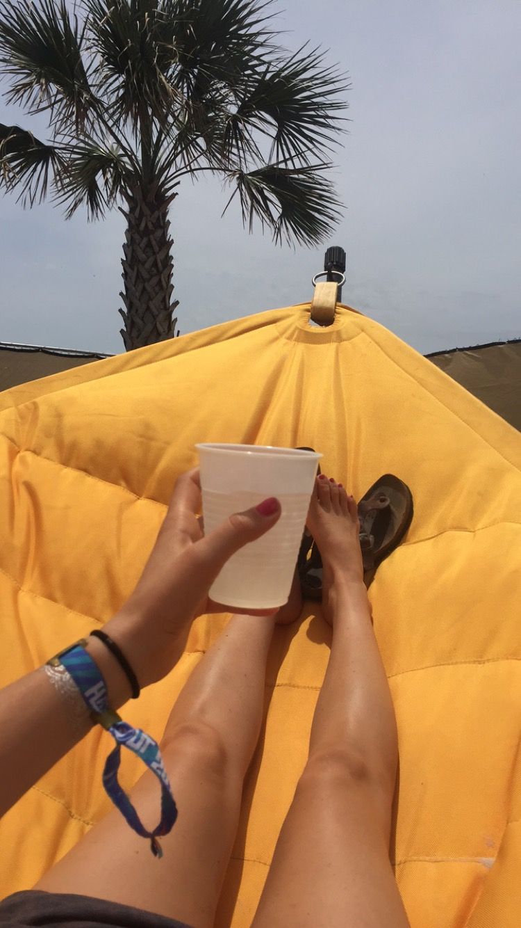 Drinking coconut water in a hammock