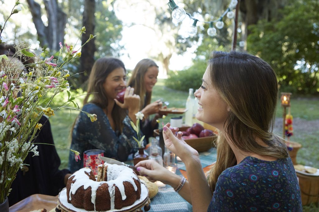 Girls eating at picnic