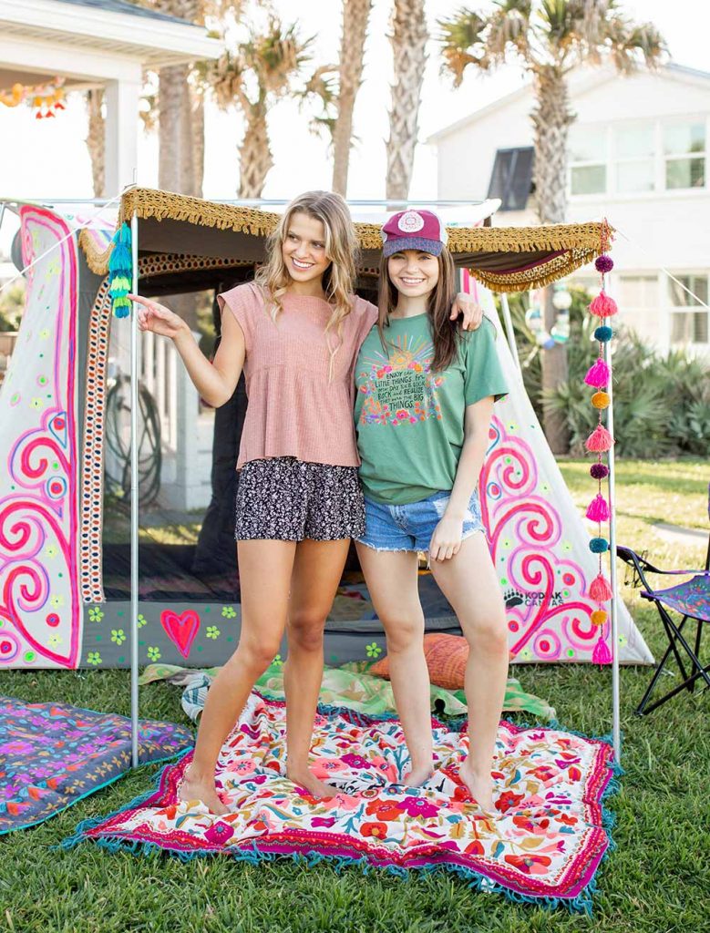 Girls in cute clothes camping in the backyard!