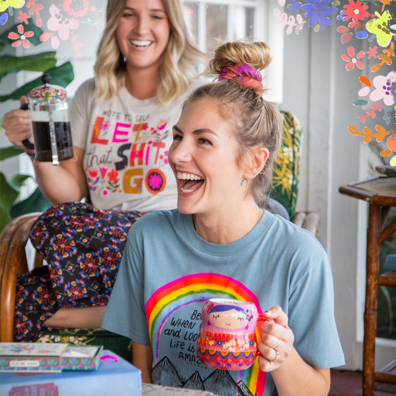 Girl holding colorful mug