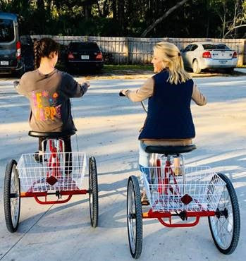 Lanier and Lesli riding trikes