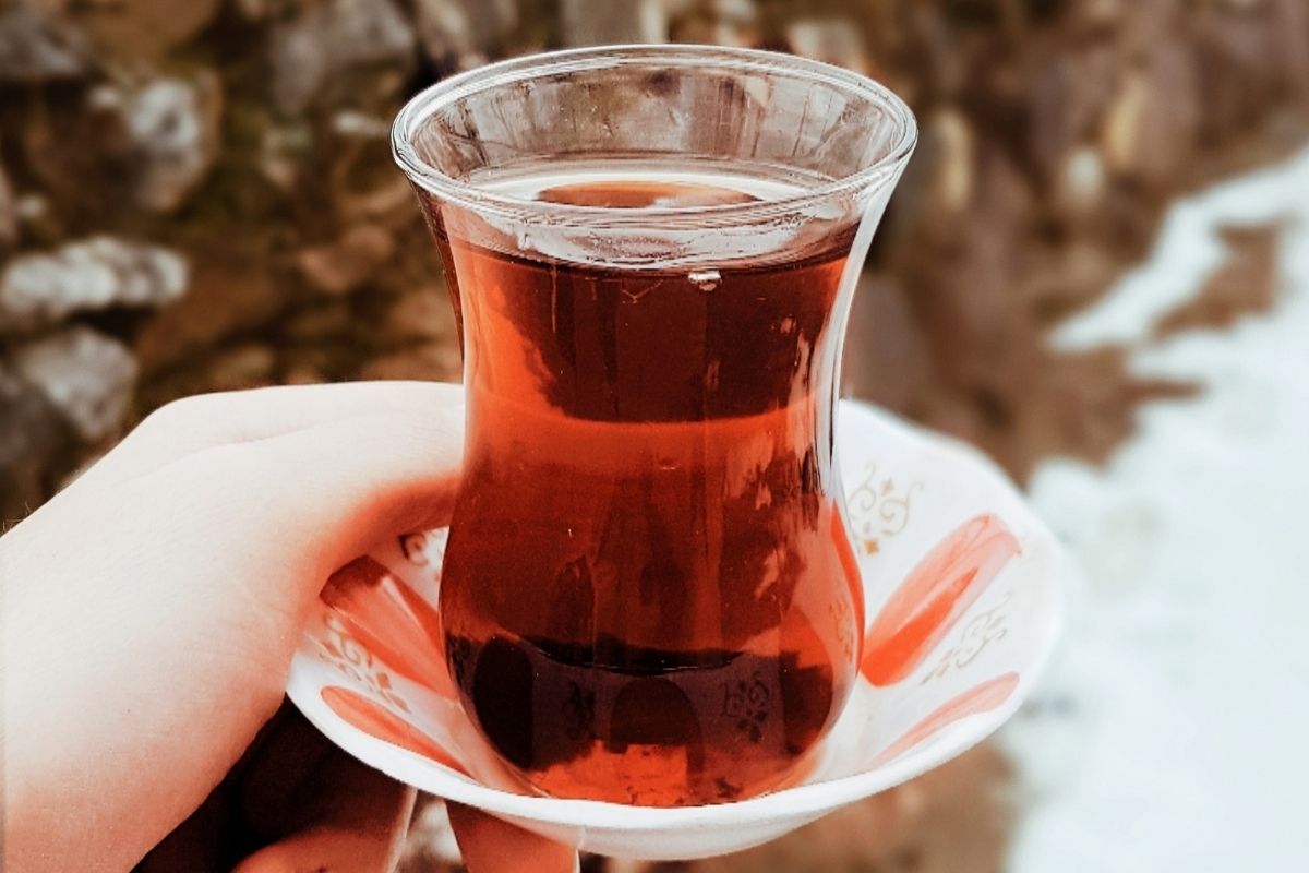 glass of hibiscus tea against snow