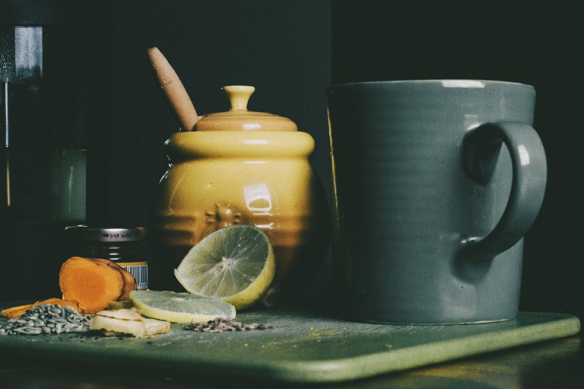 lemon, ginger, and honey next to tea mug