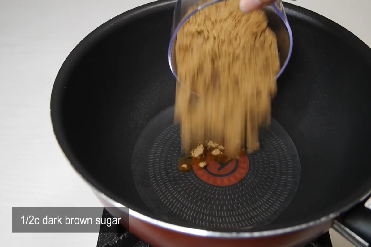 brown sugar being added to a pan
