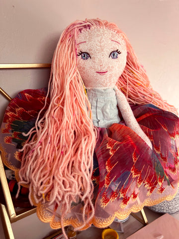 Handmade doll with light pink yarn hair