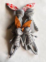 Handmade stuffed kitties and bunnies created from upcycled striped shirt