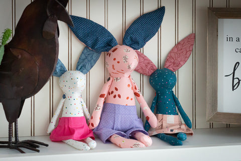 Three Bunnies sitting on a shelf