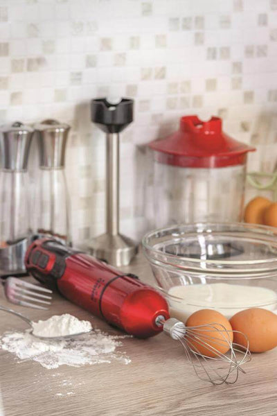 Red Hand Blender on the cooking pass with eggs