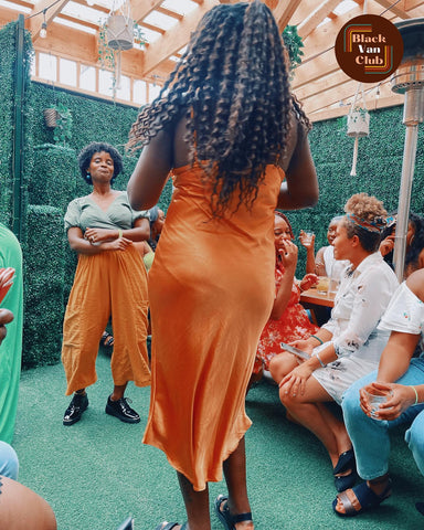 Ladies dancing at the Black Van Club event