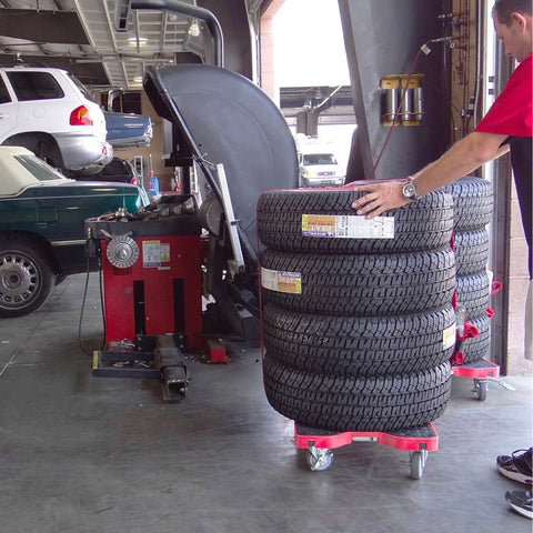 tires stacked on dolly carts