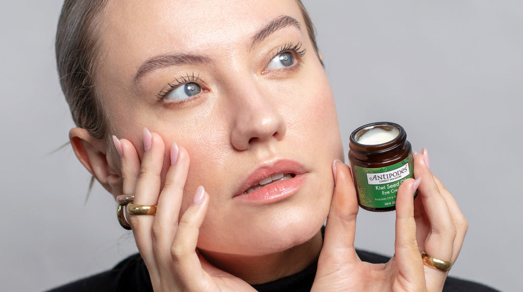 Antipodes skincare model with Kiwi Seed Oil Eye Cream