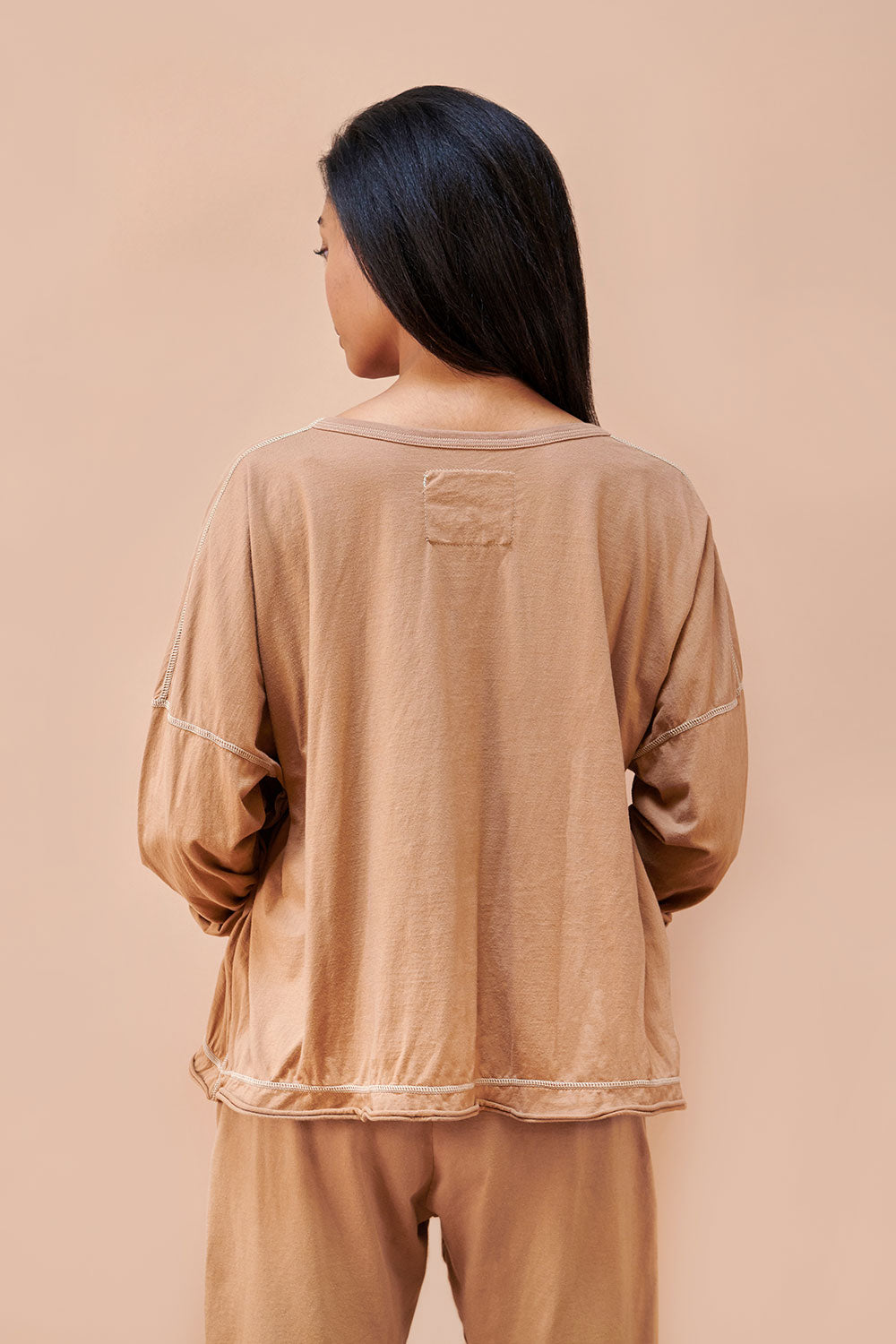 Alabama Chanin Coverup with long sleeves, shown in Camel color on model.