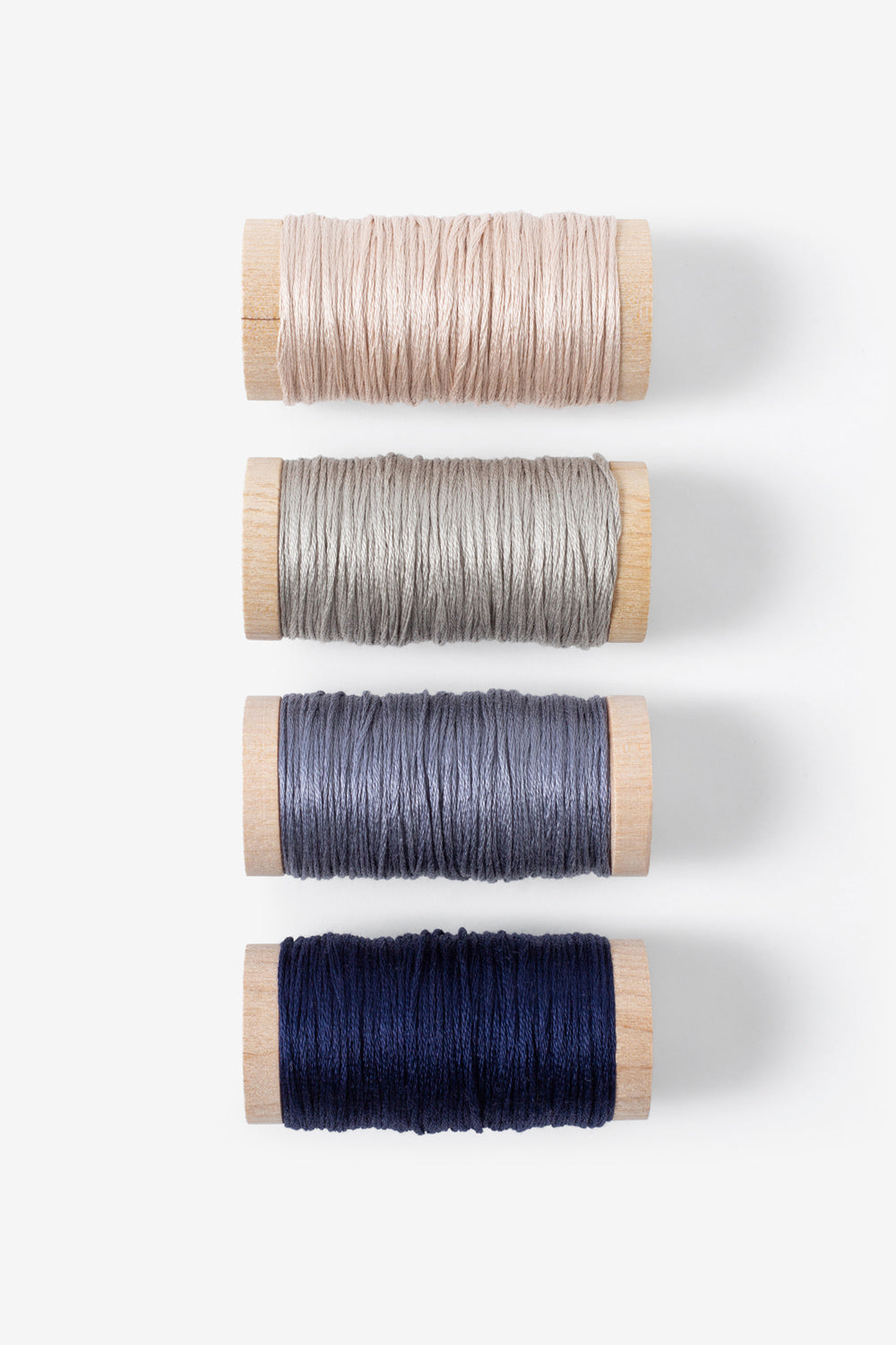 The School of Making Embroidery Floss Four Spools in Navy, Pewter, Silt, and Light Pink