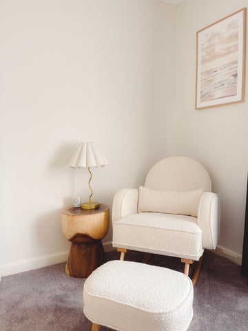 white rocking chair, timber side table, beige nursery style