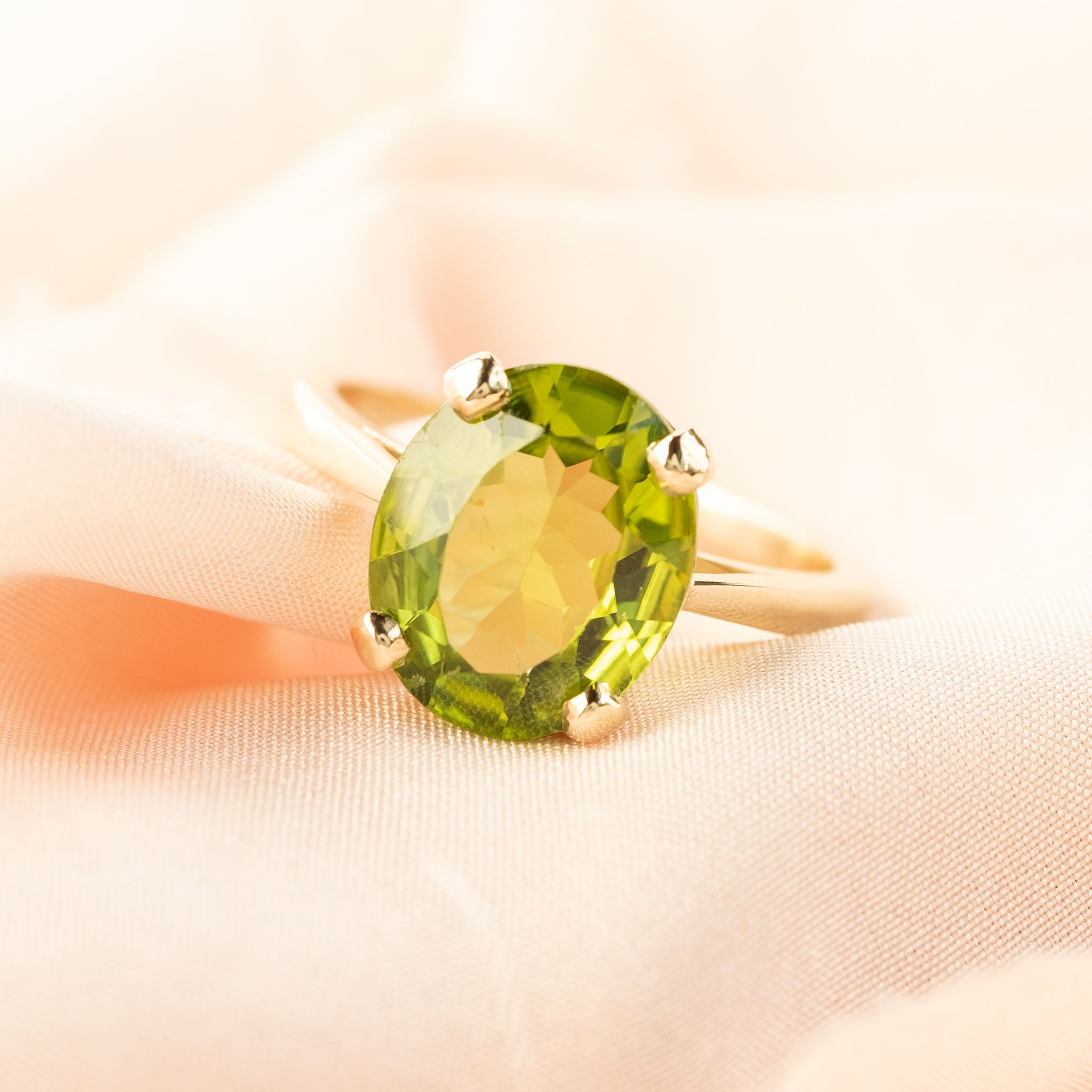 Peridot four claw gold dress ring