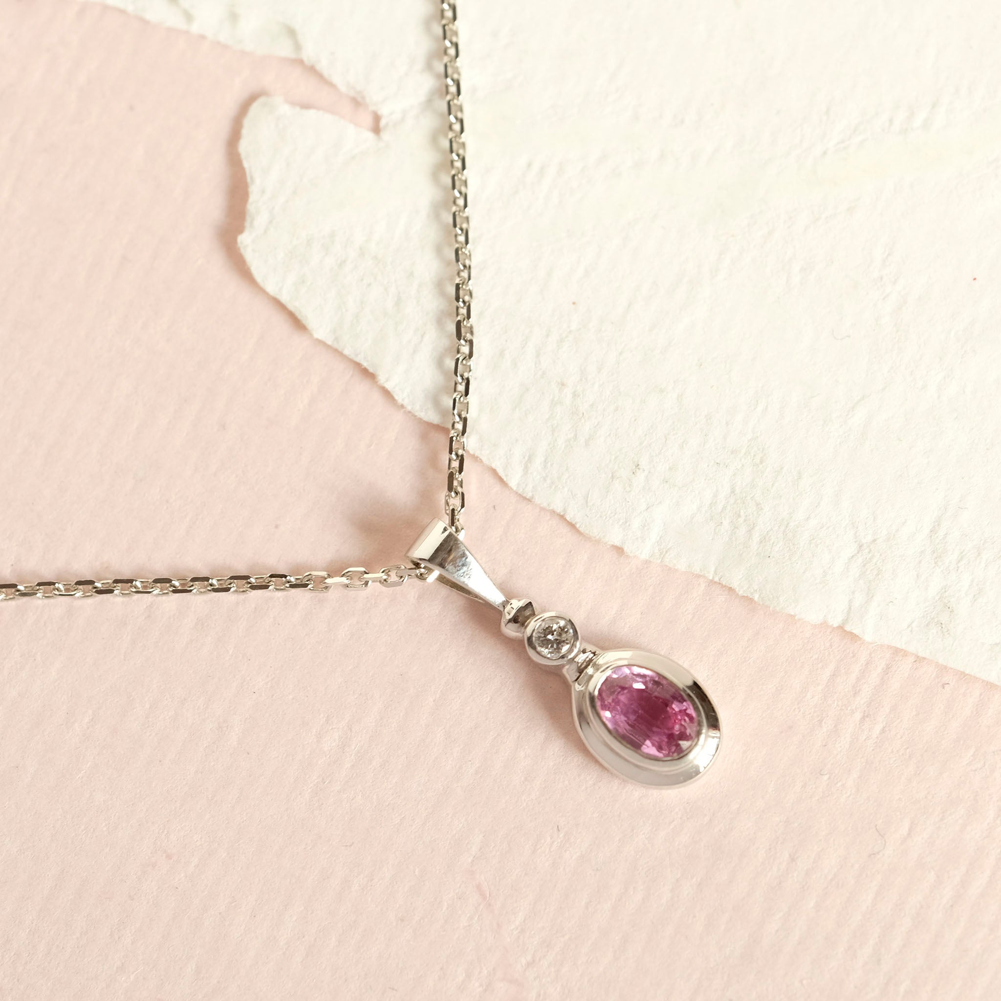 Pink sapphire and white gold pendant necklace