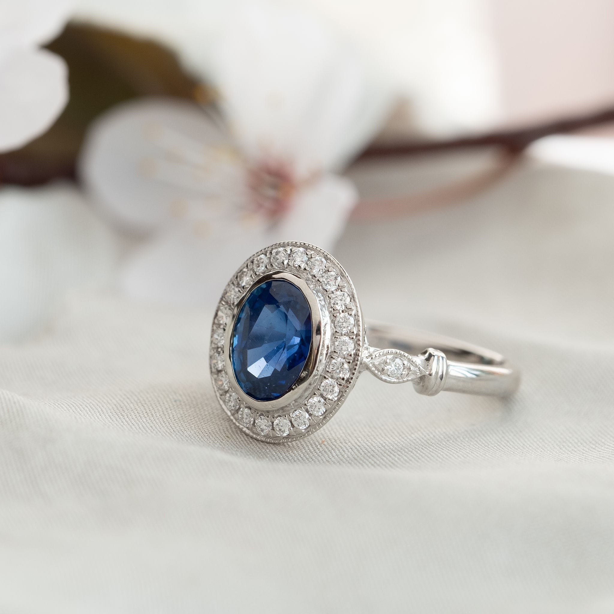 Sapphire diamond cluster engagement ring
