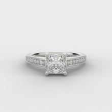 Load and play video in Gallery viewer, 0.75ct Princess Cut Solitaire Diamond Engagement Ring with Diamond Set Shoulders  Centre Diamond Weight: 0.75ct  Centre Stone Cut: Princess Cut  Diamond Weight on Shoulders: 0.30ct  Diamond Cut on Shoulders: Round Brilliant &amp; Baguette Cut  This ring is also available with Lab Grown Diamonds - contact us for further information.
