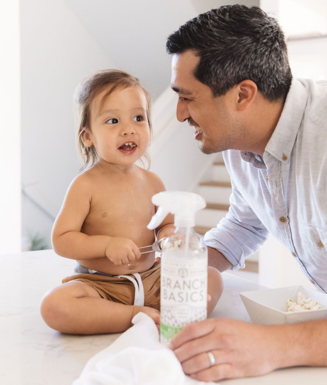 Man and child with branch basics all-purpose spray