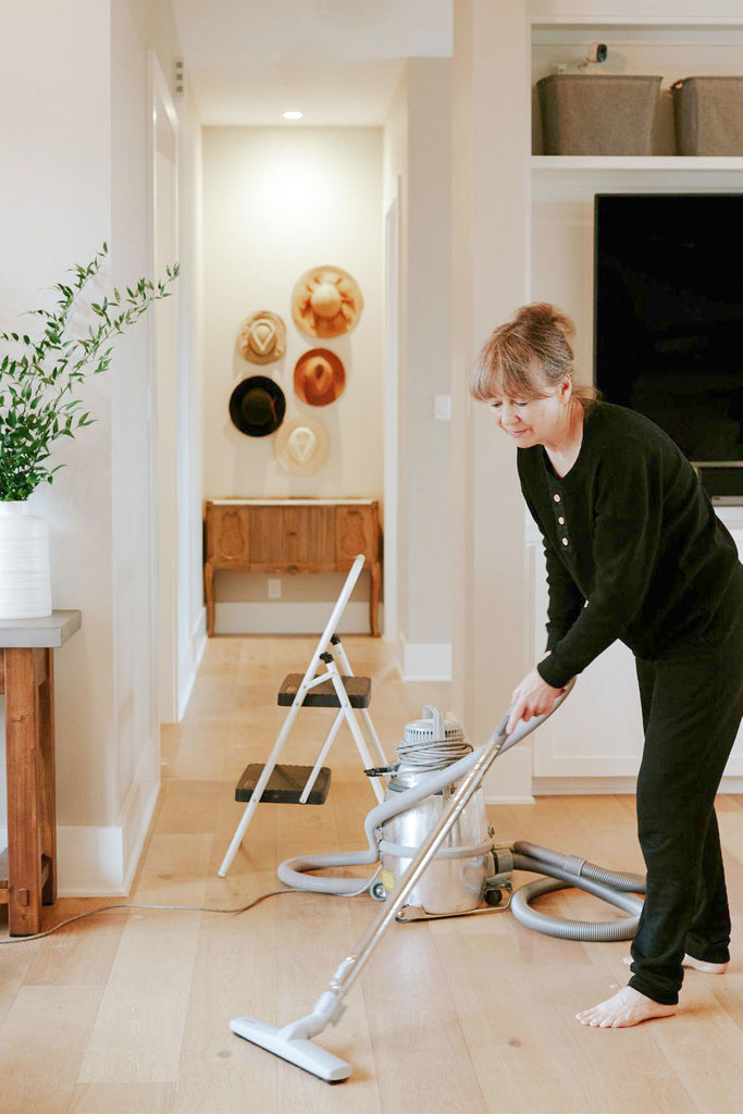 Woman HEPA vacuuming