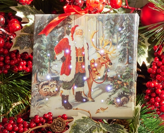 Raz Imports Lit Canvas Art Christmas Scene With Santa and Reindeer in Snowy Woods
