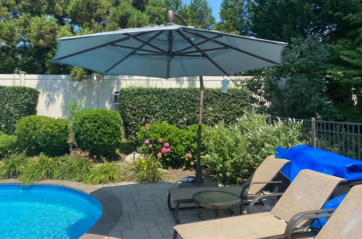 Treasure Garden Cantilever Patio Umbrella with Sunbrella Fabric Poolside Chaise for Long Island Backyard