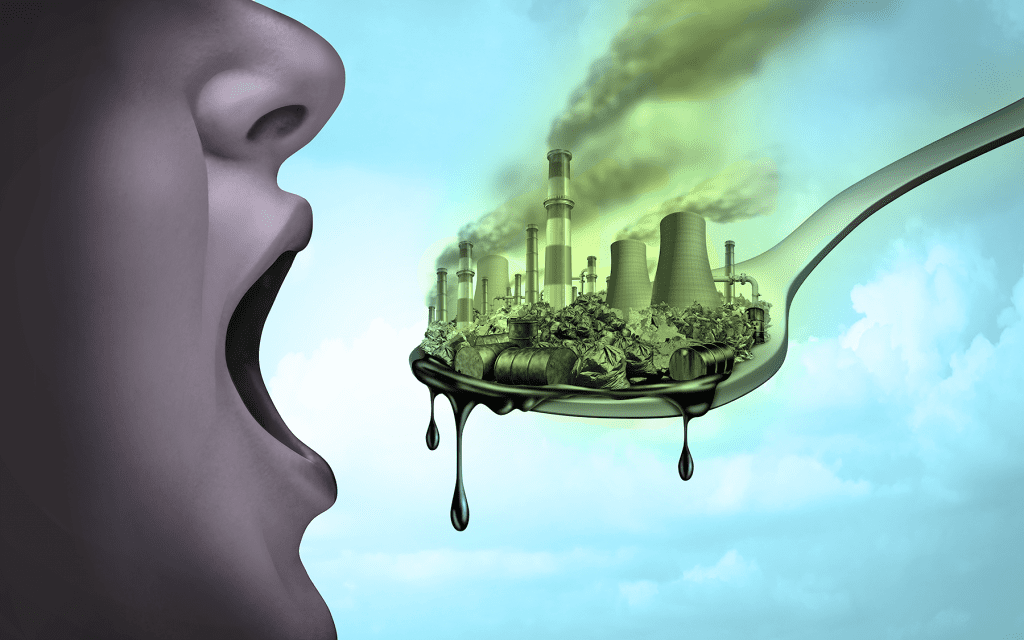 image of someone eating a city of toxins and pollution 
