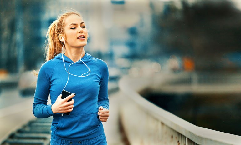 Girl in blue sweatshirt running