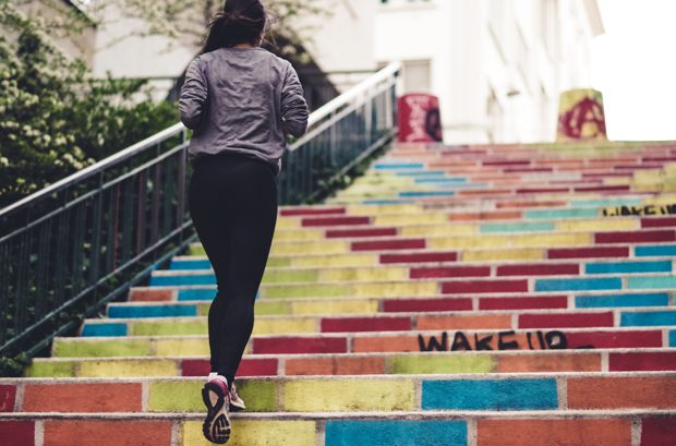 woman running city steps