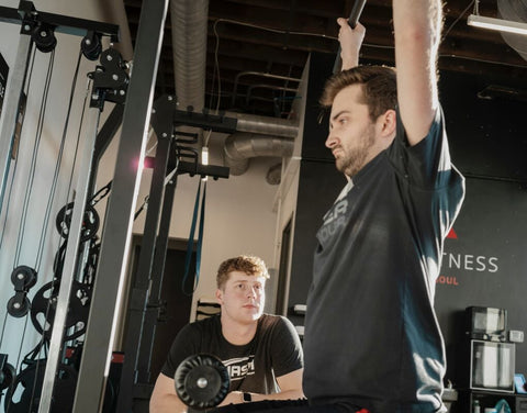 An image of a personal trainer and his client  