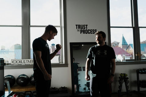 An image of a persoanl trainer and his client 