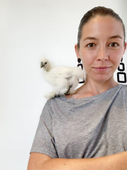 owner Leanne Luce with favorite chicken Blanche at Studio Cluck