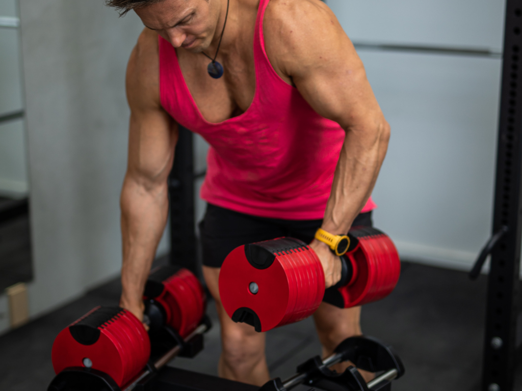 Compact Adjustable Dumbbells in the strong arms of Aaron Curtis. (Full 32KG weight). 