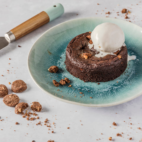 chocolate pudding with cookies and dairy free ice cream on a plate 