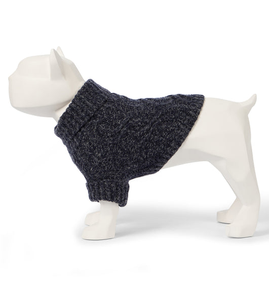 A model of a small dog wearing a cable knit turtleneck sweater. 
