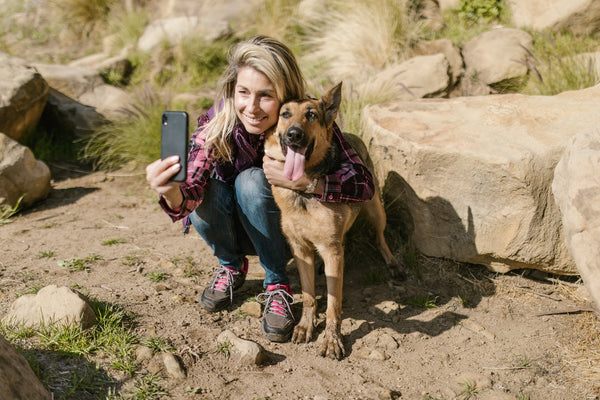 woman taking a selfie with her dog 