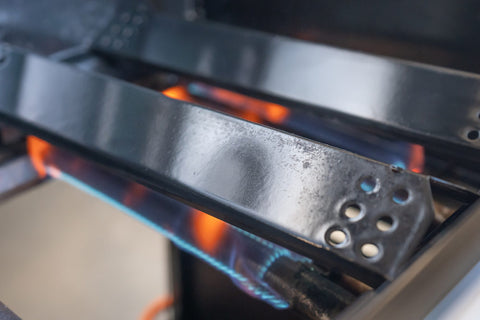 close up of a gas grill flare-up