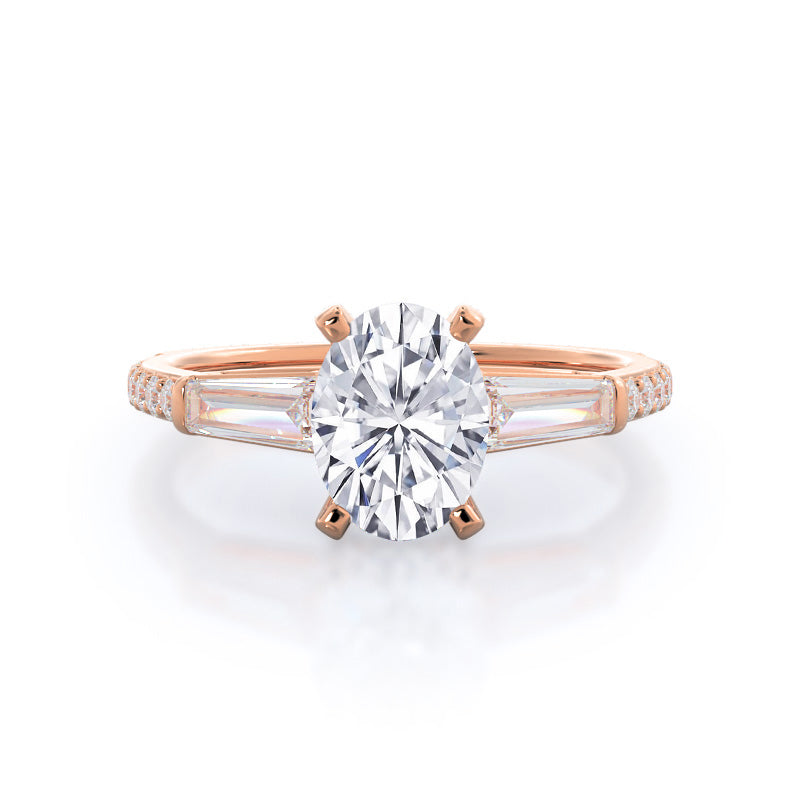 three stone tapered baguette diamond and rose gold engagement ring