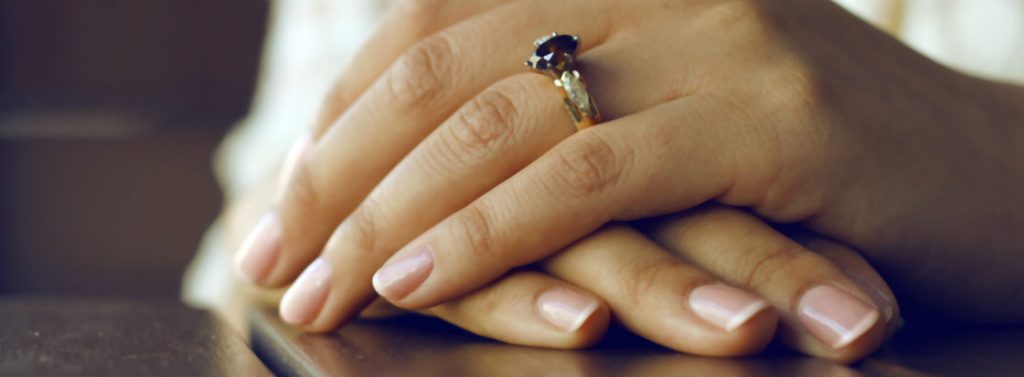 womans hands wearing ring with chocolate diamonds