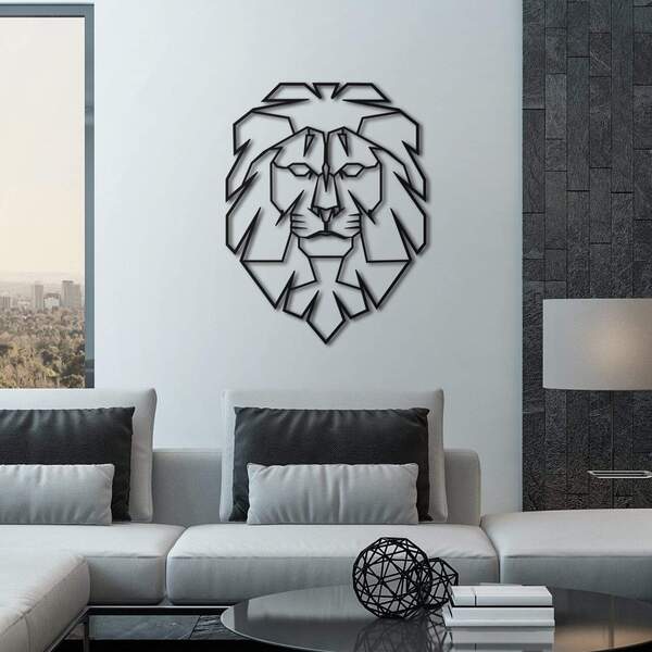 Tête de lion en métal sur un mur